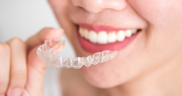 how Invisalign fixes teeth permanently